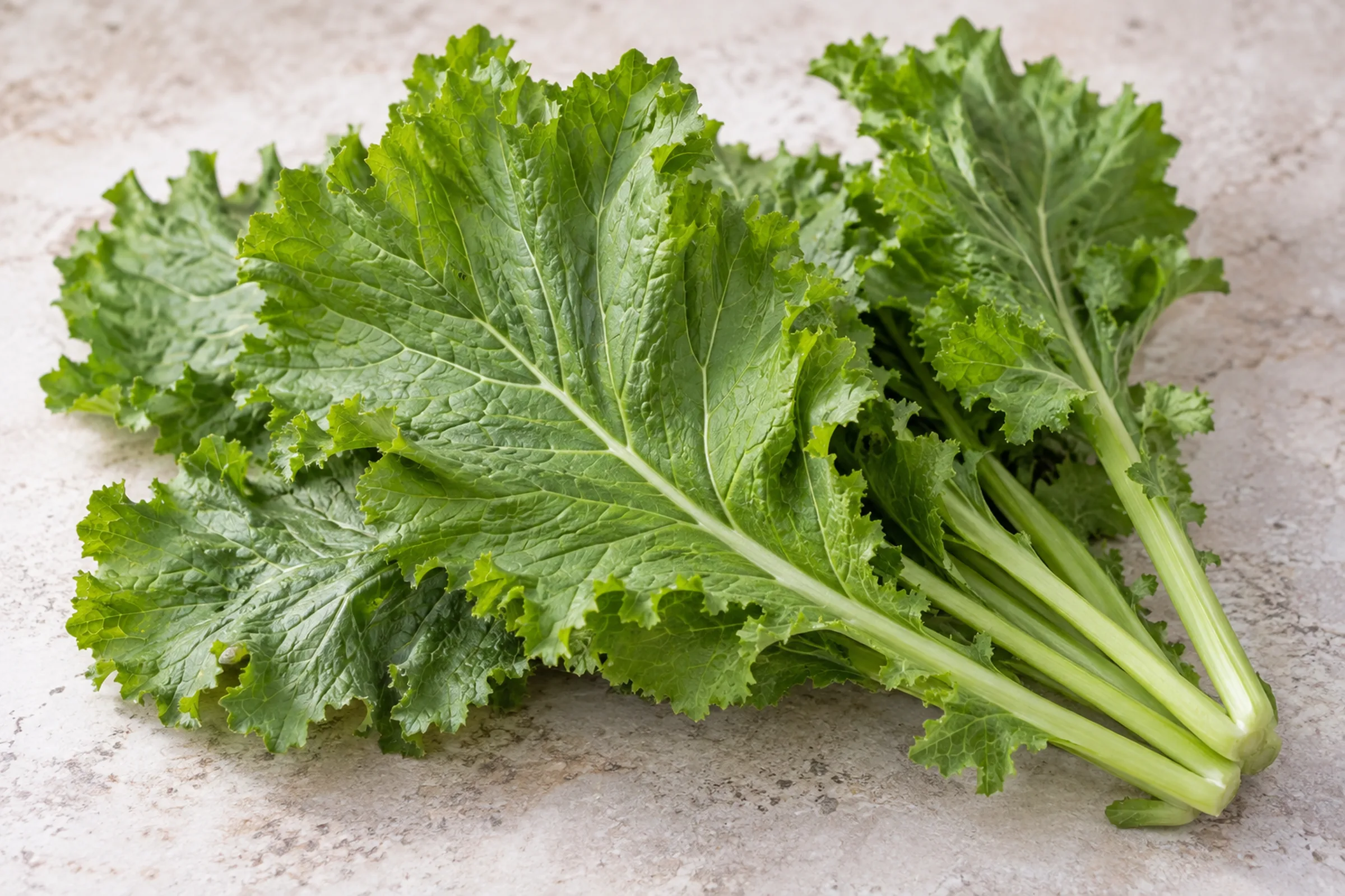 Fresh mustard greens with ruffled, peppery-looking leaves